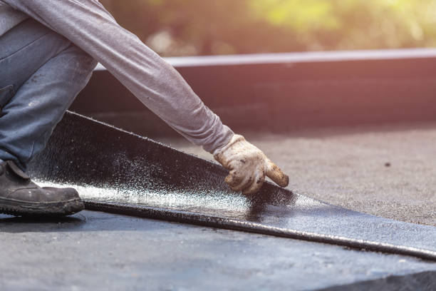 Professional Basement Waterproofing technician working in Petersburg, KY
